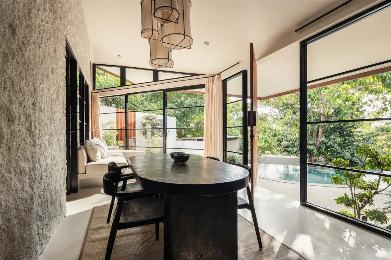 The Wabi Sabi Realm in the Poetic Forest: Design of a Natural Villa Under a Flipped Roof