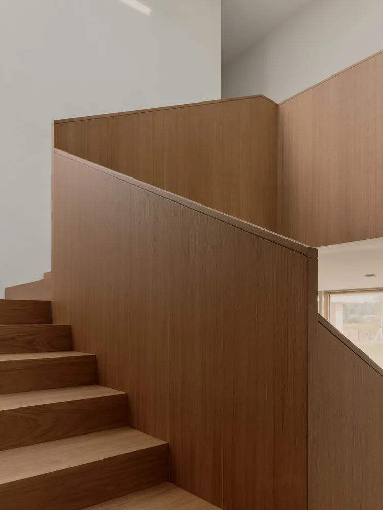 A minimalist villa design with warm, natural, smooth details, simple linear symmetry rhythm