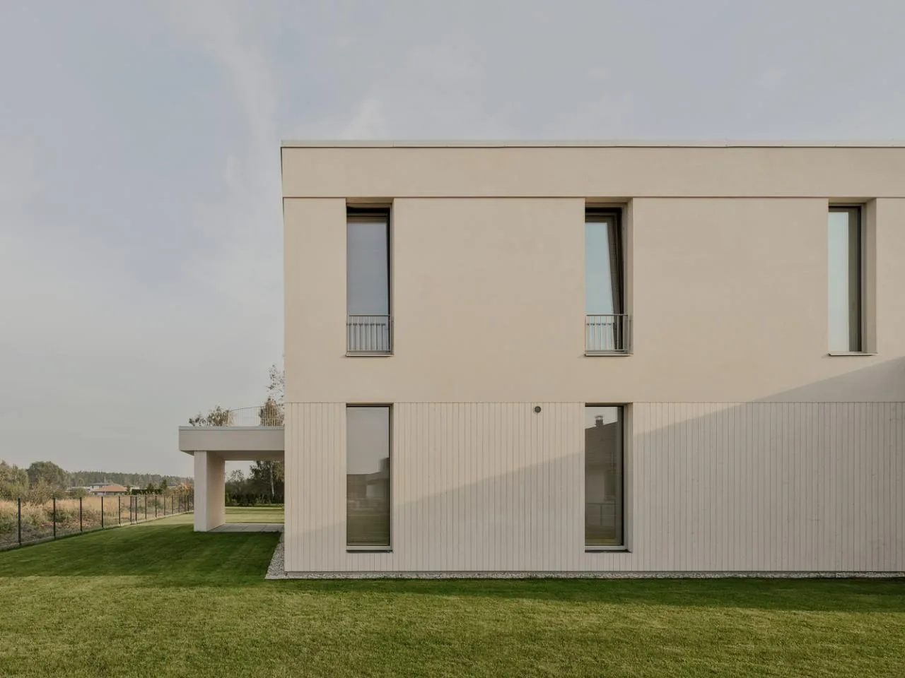 A minimalist villa design with warm, natural, smooth details, simple linear symmetry rhythm