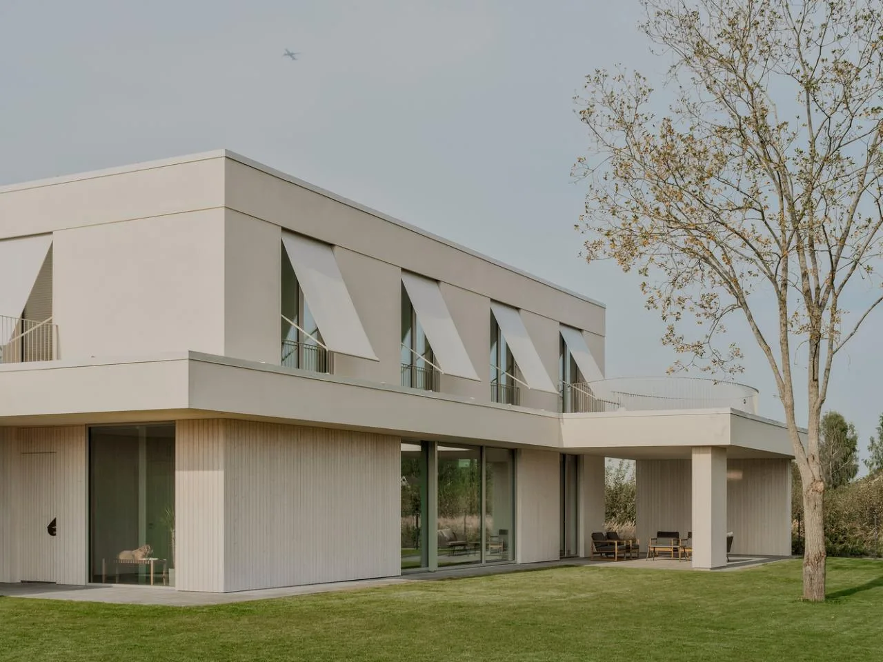 A minimalist villa design with warm, natural, smooth details, simple linear symmetry rhythm
