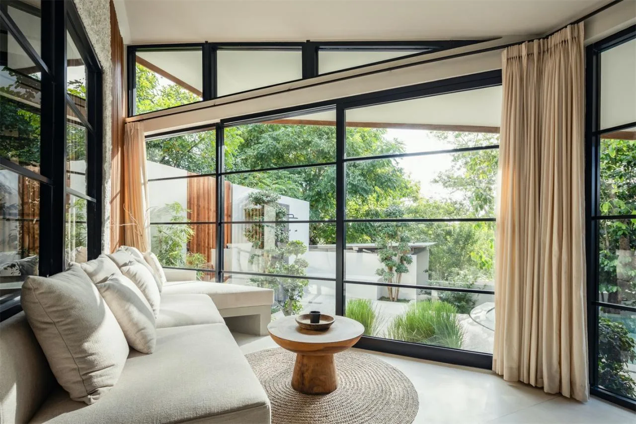 The Wabi Sabi Realm in the Poetic Forest: Design of a Natural Villa Under a Flipped Roof