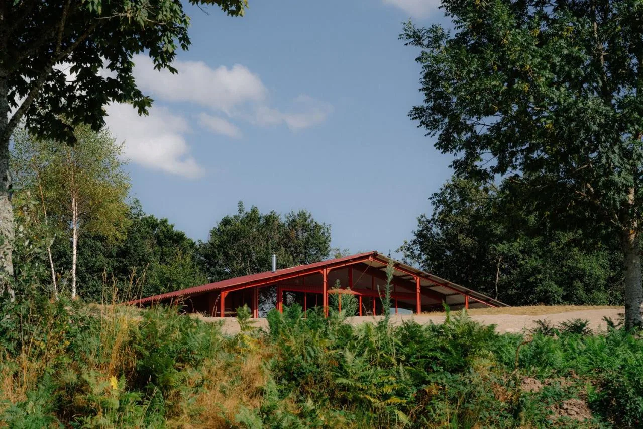 A serene vacation home design with red gemstones hidden in a lush and magnificent environment